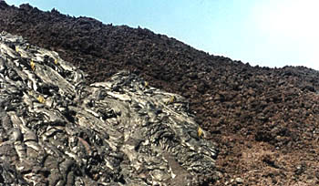 Photo showing aa in the background and pahoehoe in the foreground.